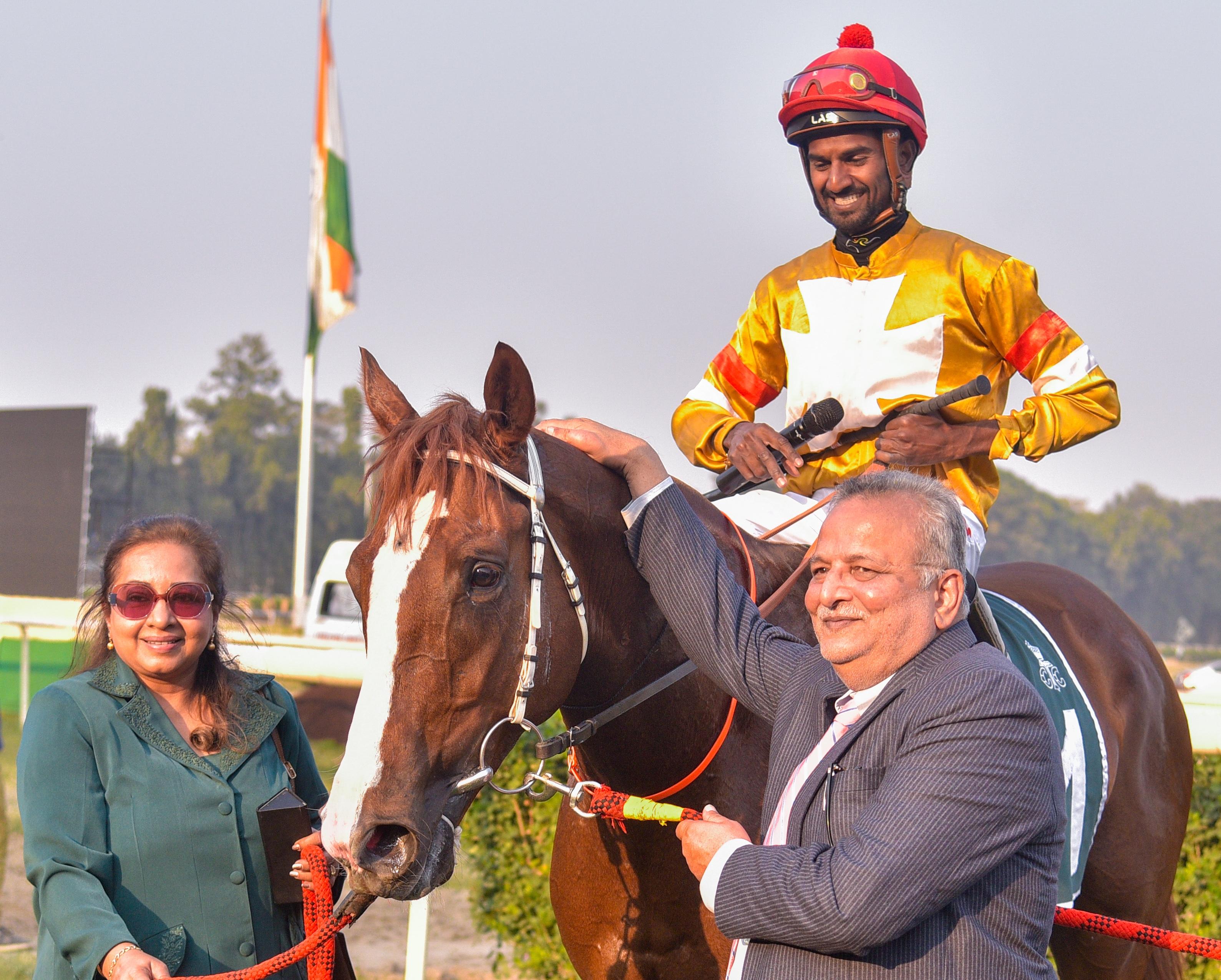 The Calcutta Derby winner Arrvied (Antony Raj-up), is being led in by owner Vikram Bachhawat (right) and wife Priya at RCTC on Sunday. Picture by Sourav Sarkar